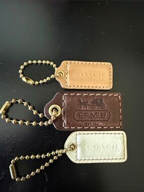 Coach Leather Tag Keychain Trio in Tan, Brown & Cream